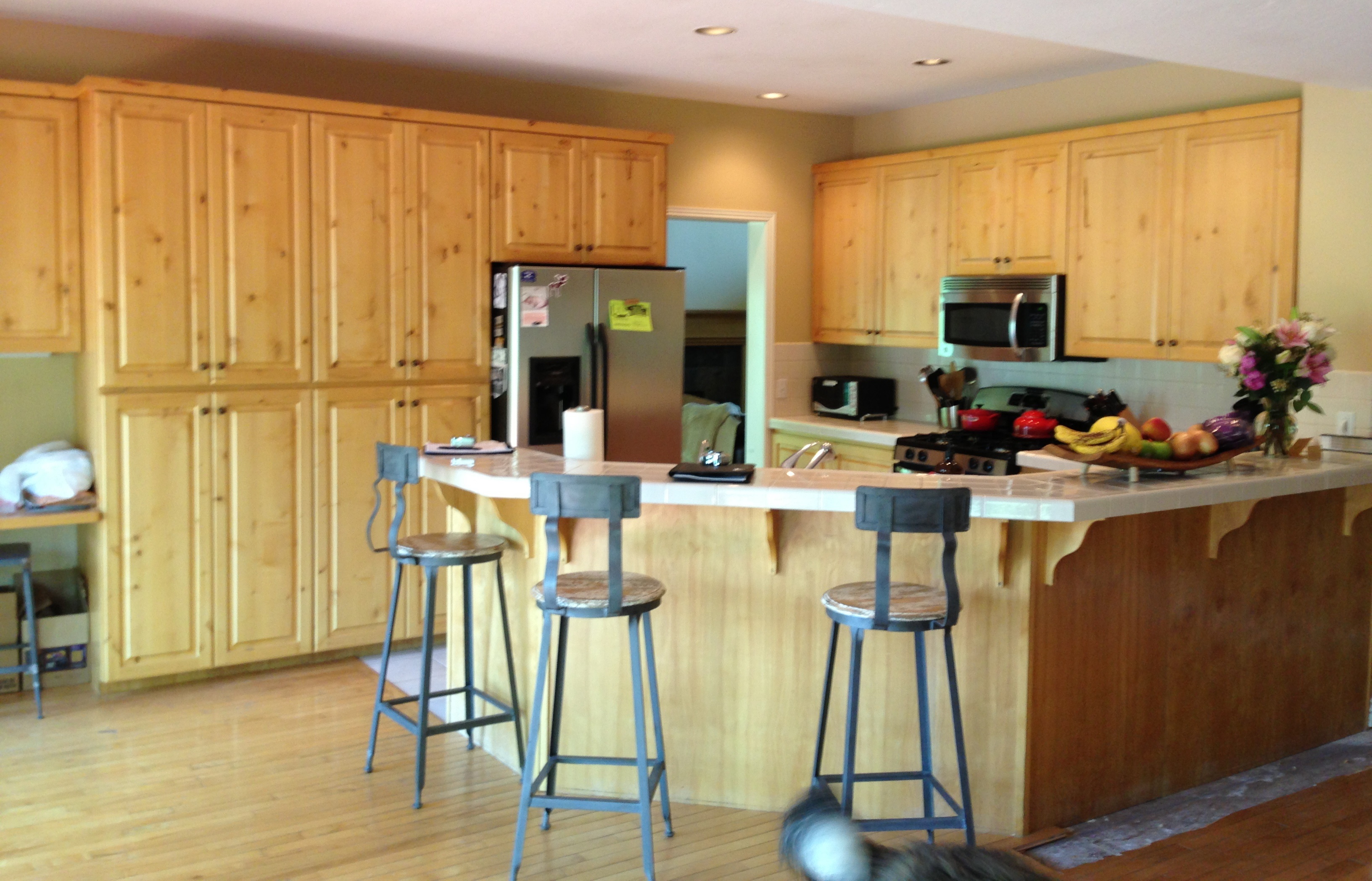 A Transitional White Kitchen with a Dark Cherry Wood Island